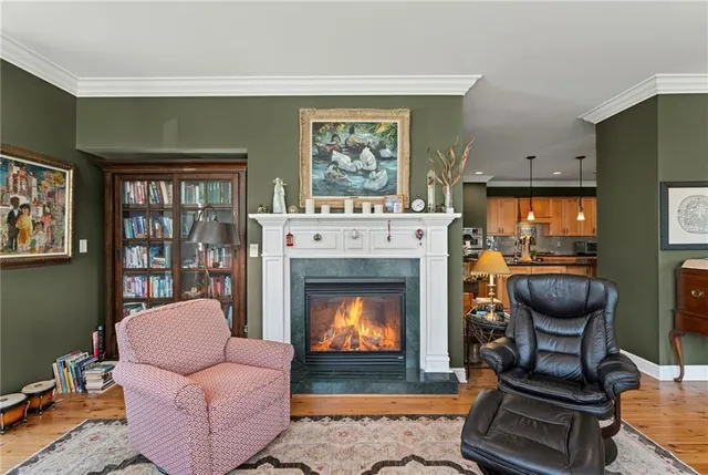 a living room with furniture and a lamp