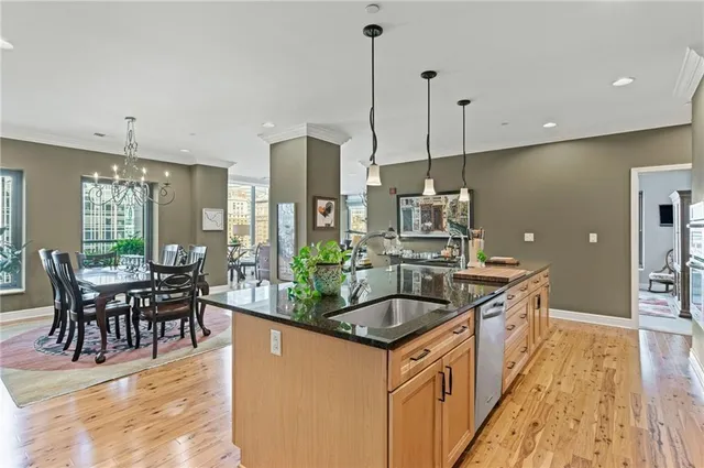 a kitchen with a sink a counter and cabinets