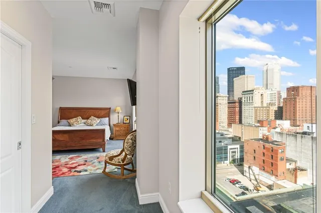 a view of a livingroom with furniture window and wooden floor