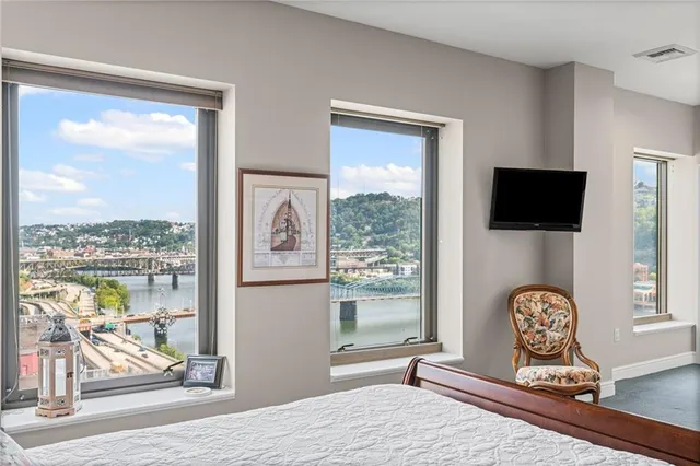 a bathroom with a granite countertop sink a mirror and vanity