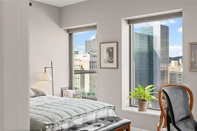 a bedroom with a bed and a table