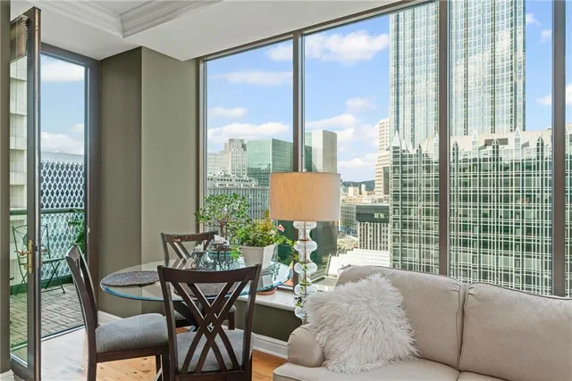 a view of a dining room with furniture window and outside view