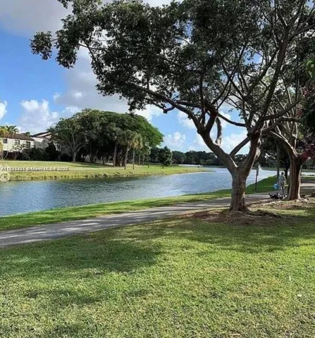 a view of a lake with houses in the background