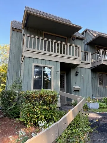 front view of a house with a small yard