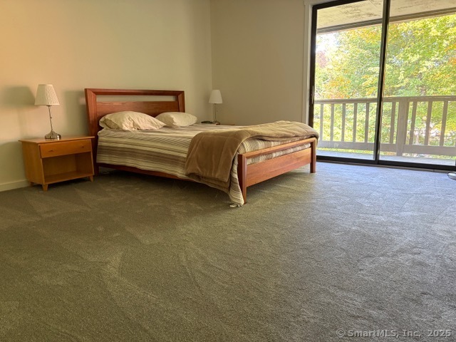 8 Village Road, Unit 8 Southington, CT 06489 - Photo 13 of 25 a bedroom with a bed and a large window