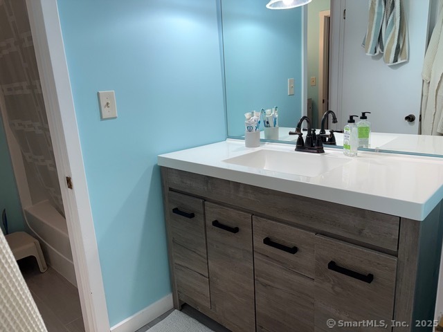 8 Village Road, Unit 8 Southington, CT 06489 - Photo 15 of 25 a bathroom with a sink vanity and a mirror