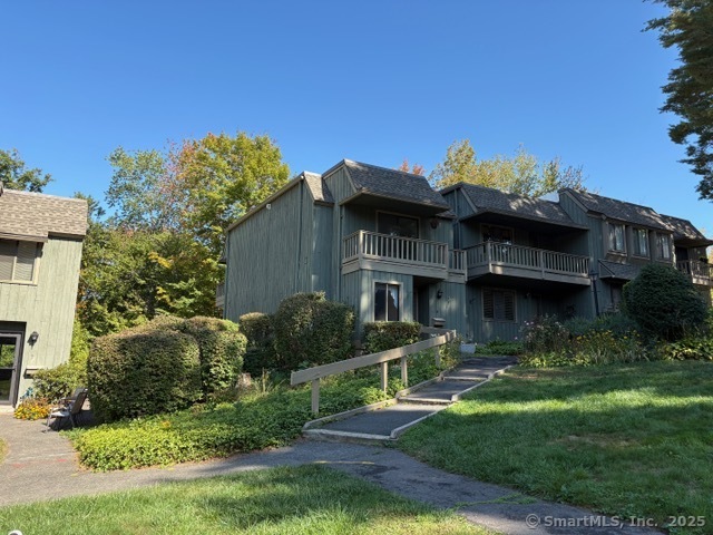 8 Village Road, Unit 8 Southington, CT 06489 - Photo 2 of 25 a front view of a house with garden
