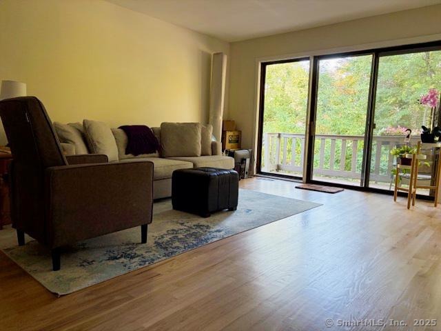8 Village Road, Unit 8 Southington, CT 06489 - Photo 5 of 25 a living room with furniture large windows and wooden floor