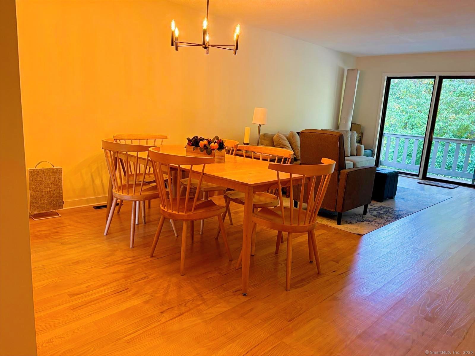 8 Village Road, Unit 8 Southington, CT 06489 - Photo 6 of 25 a view of a dining room with furniture window and wooden floor