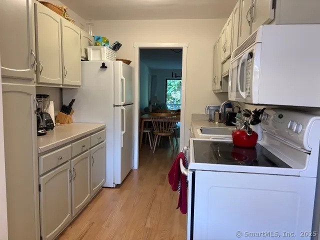 a kitchen with stainless steel appliances a refrigerator and a stove