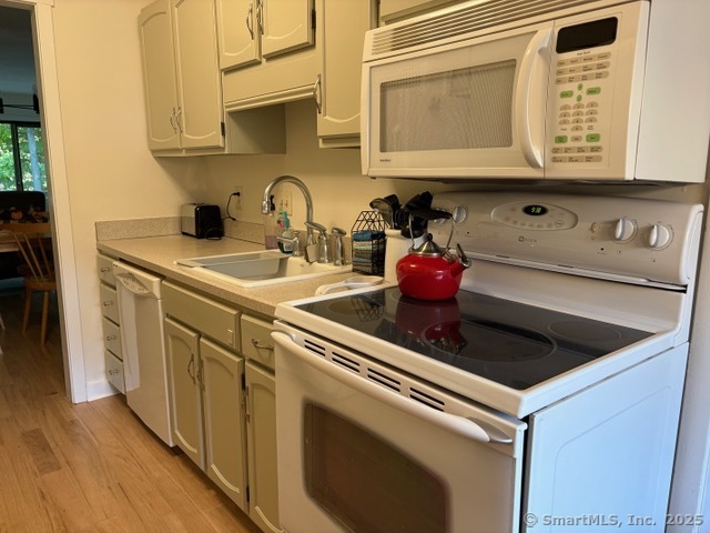8 Village Road, Unit 8 Southington, CT 06489 - Photo 10 of 25 a kitchen with stainless steel appliances granite countertop a sink and a stove
