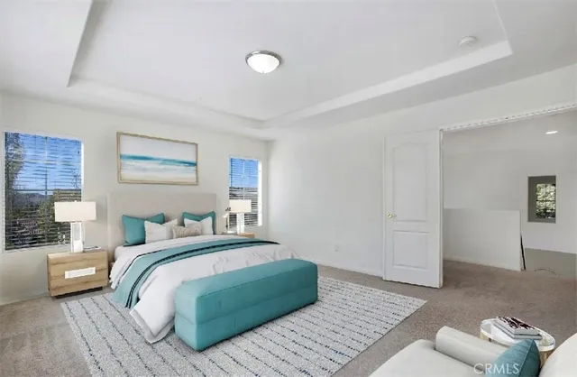 a bedroom with a bed and a couch