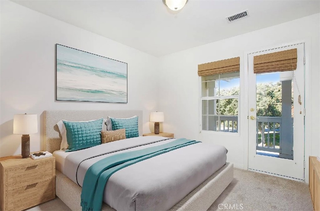 12 Avenida Reflexion San Clemente, CA 92673 - Photo 16 of 42 a bedroom with a bed and a large window