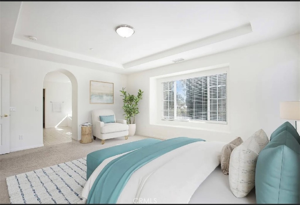12 Avenida Reflexion San Clemente, CA 92673 - Photo 17 of 42 a bedroom with a bed and a large window