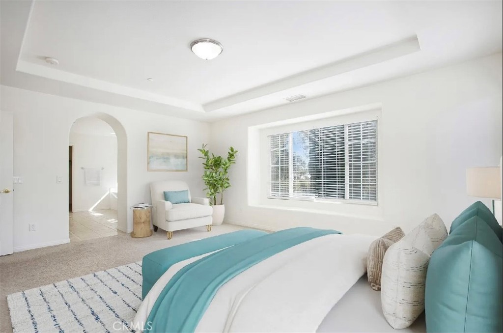 12 Avenida Reflexion San Clemente, CA 92673 - Photo 20 of 42 a bedroom with a bed and a large window