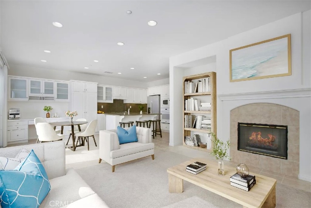 12 Avenida Reflexion San Clemente, CA 92673 - Photo 21 of 42 a living room with furniture and a fireplace