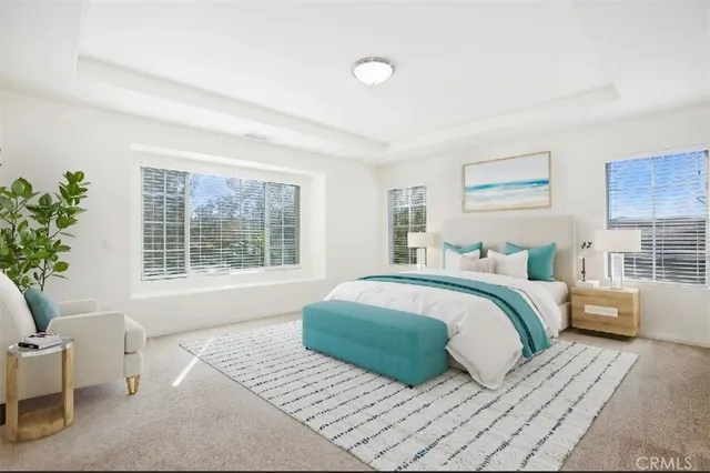 a bedroom with a large bed and a window