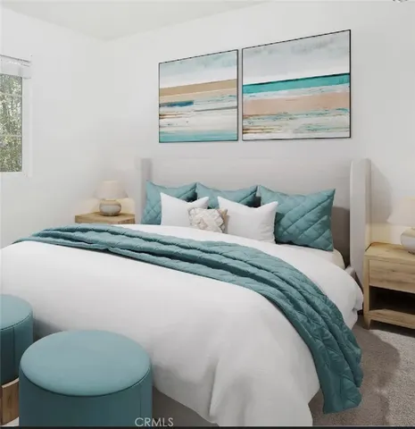 a bedroom with a bed and chair