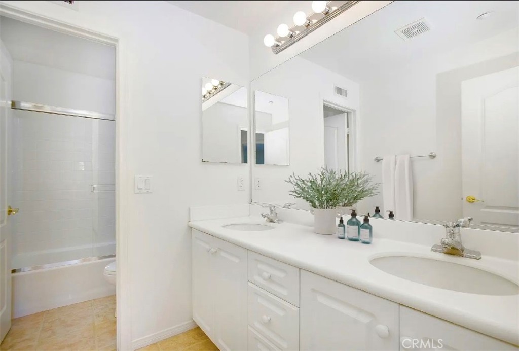 12 Avenida Reflexion San Clemente, CA 92673 - Photo 25 of 42 a bathroom with a sink and a mirror