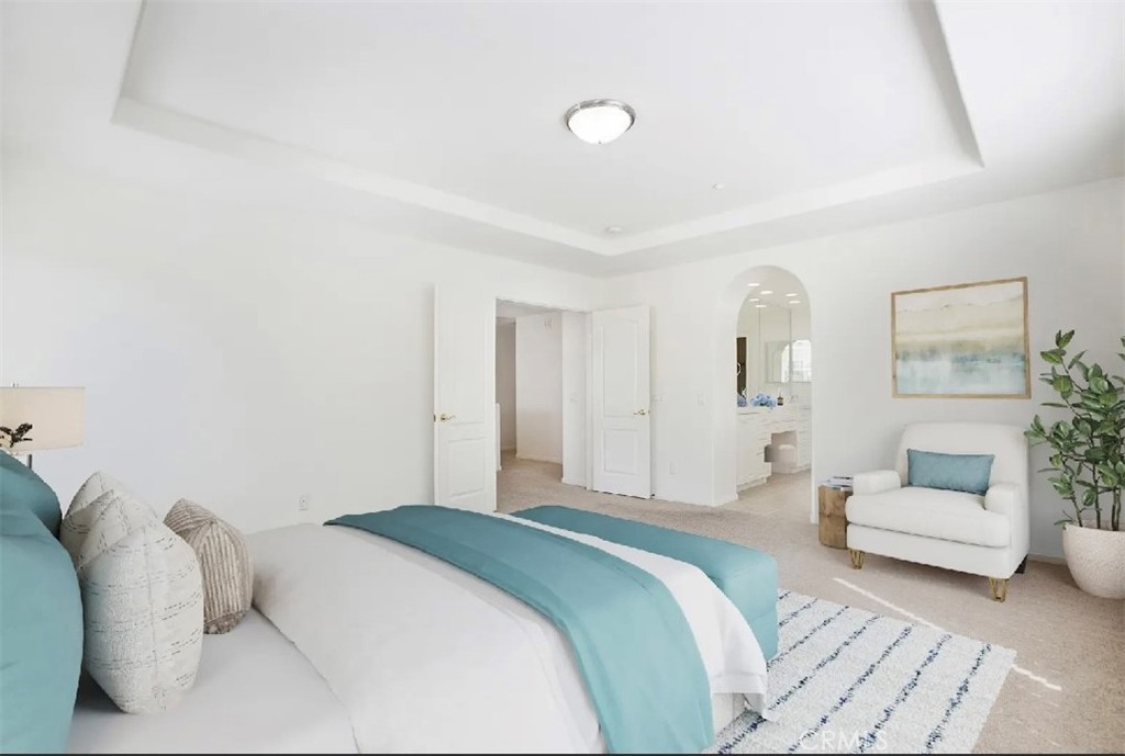 12 Avenida Reflexion San Clemente, CA 92673 - Photo 27 of 42 a bedroom with a white bed and white walls
