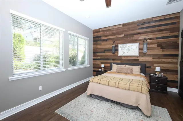 a bedroom with a bed and window