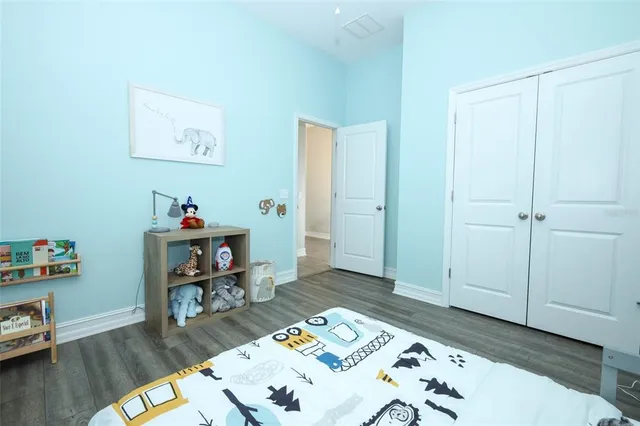 a view of a workspace with furniture and wooden floor