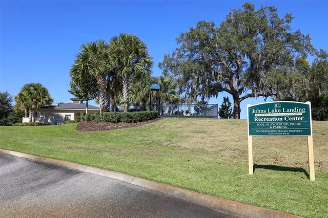 a view of a park with large trees