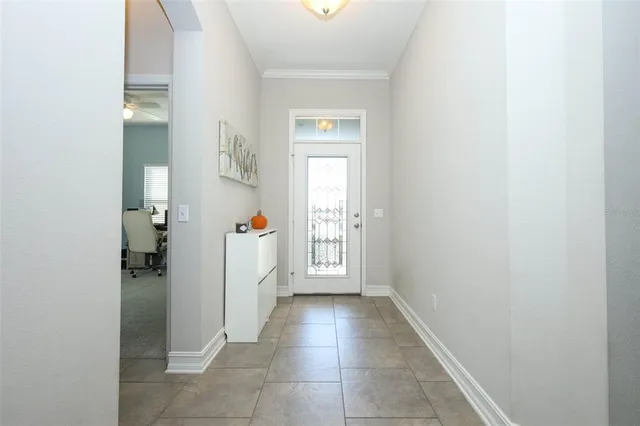 a view of a hallway view with wooden floor and closet