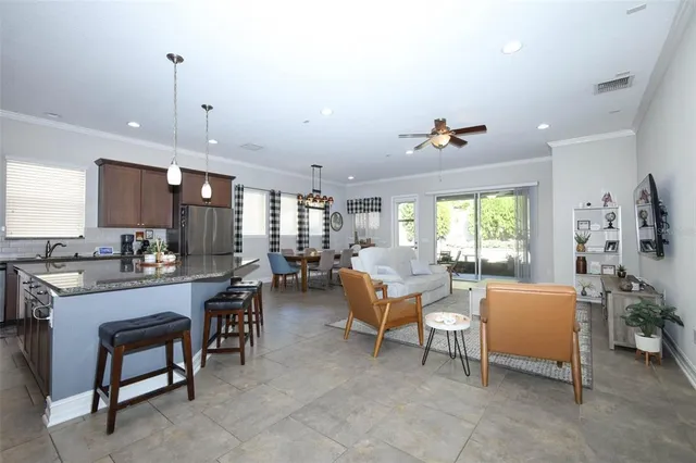 a living room with fireplace furniture and a window