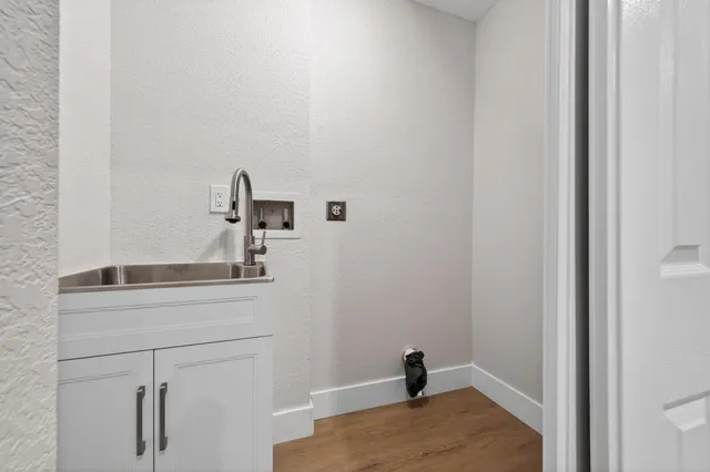 a bathroom with a sink and vanity