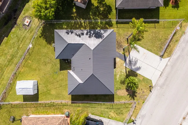 an aerial view of a house with swimming pool