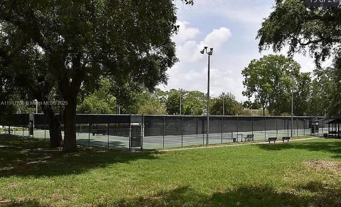 9230 Lagoon Place, Unit 215 Davie, FL 33324 - Photo 16 of 19 a view of a park with large trees