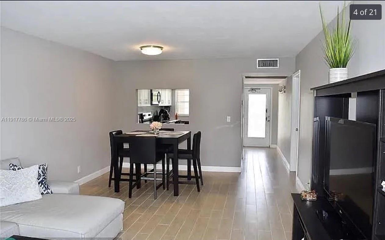 9230 Lagoon Place, Unit 215 Davie, FL 33324 - Photo 4 of 19 a dining room with furniture and window