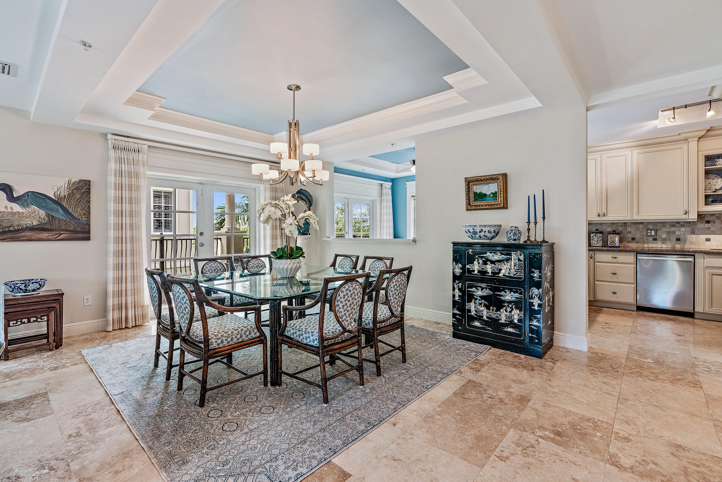 126 Tierra Lane, Unit 4 Jupiter, FL 33477 - Photo 12 of 45 a view of a dining room with furniture and chandelier