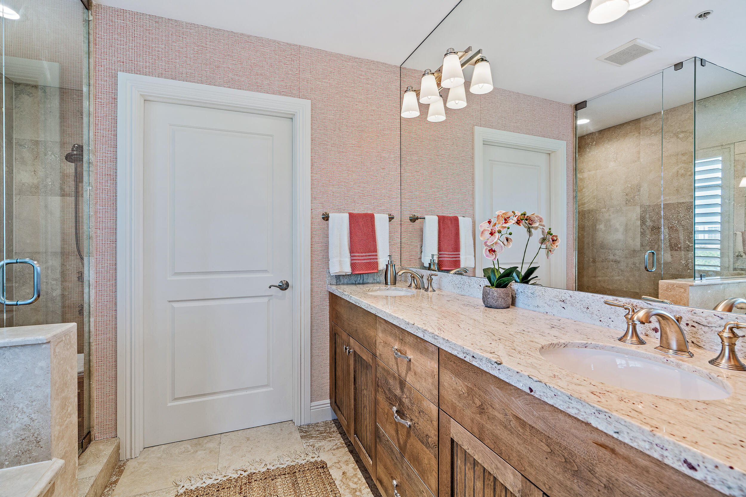 126 Tierra Lane, Unit 4 Jupiter, FL 33477 - Photo 13 of 45 a bathroom with a granite countertop sink and a mirror
