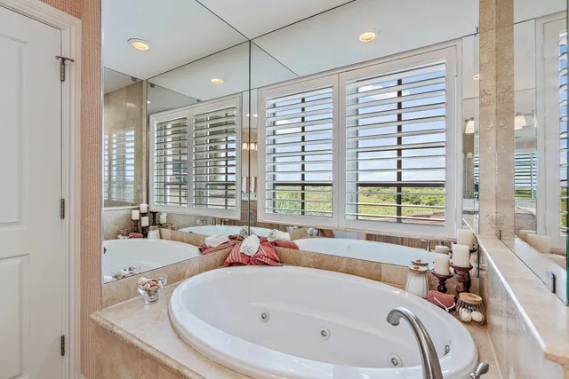 a bathroom with a tub and a sink