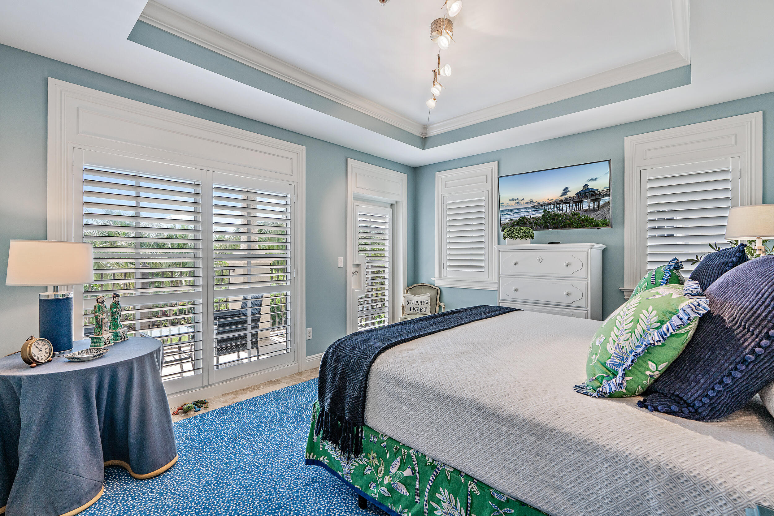 126 Tierra Lane, Unit 4 Jupiter, FL 33477 - Photo 18 of 45 a bedroom with a bed and a table