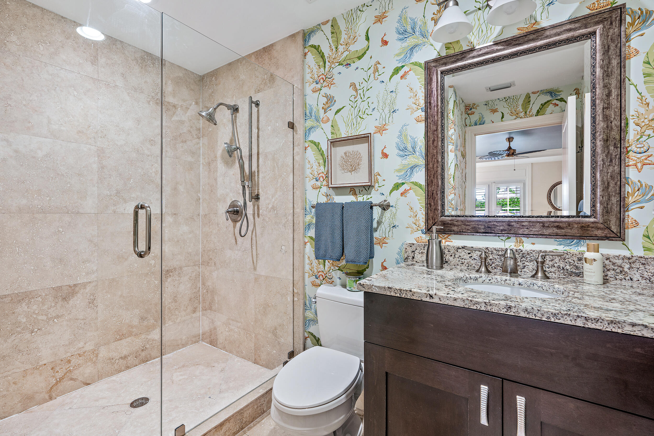 126 Tierra Lane, Unit 4 Jupiter, FL 33477 - Photo 20 of 45 a bathroom with a sink toilet vanity and shower