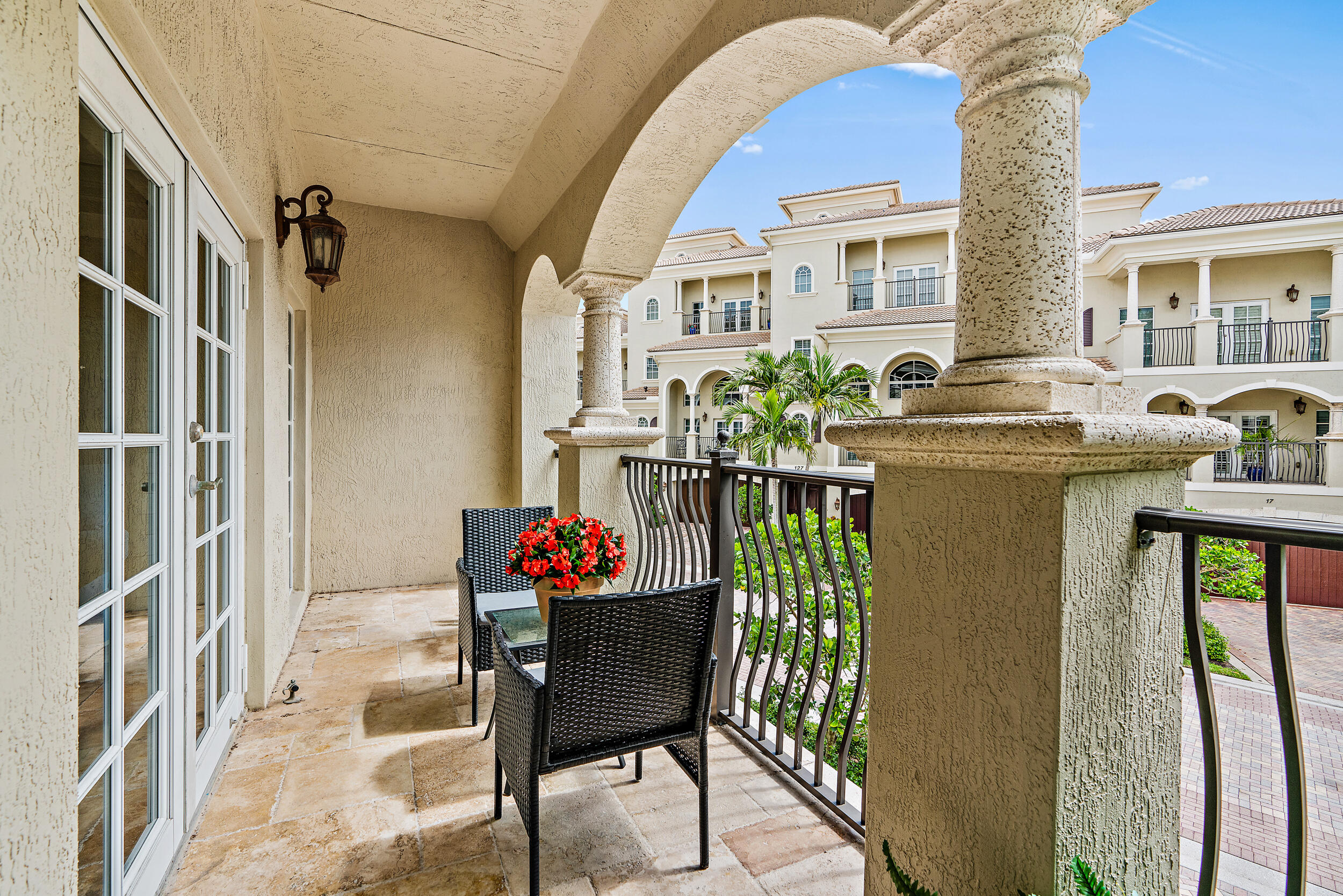 126 Tierra Lane, Unit 4 Jupiter, FL 33477 - Photo 21 of 45 a dining room with furniture and a chandelier