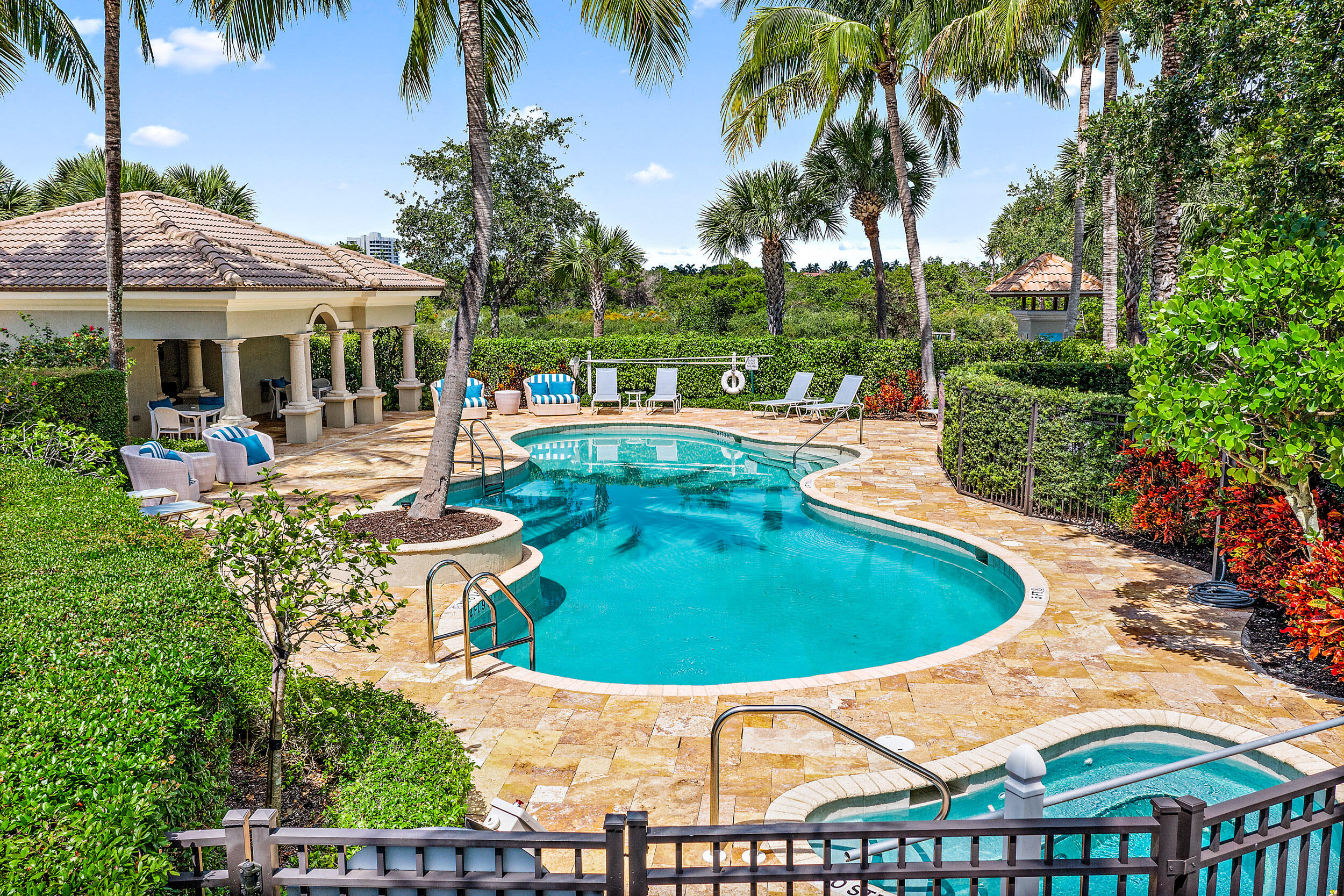 126 Tierra Lane, Unit 4 Jupiter, FL 33477 - Photo 23 of 45 a view of a swimming pool with a patio