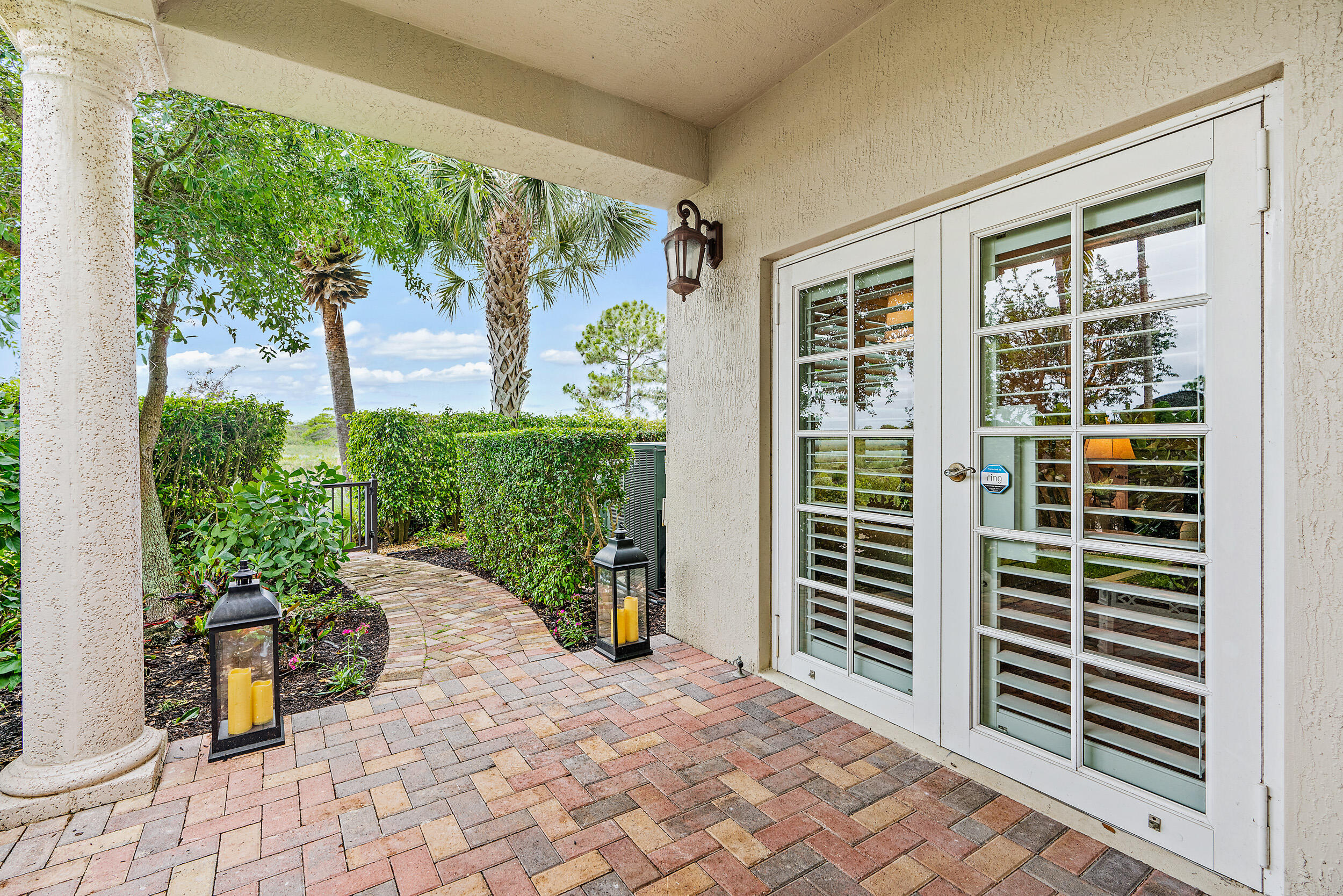 126 Tierra Lane, Unit 4 Jupiter, FL 33477 - Photo 29 of 45 a view of a back yard from a porch