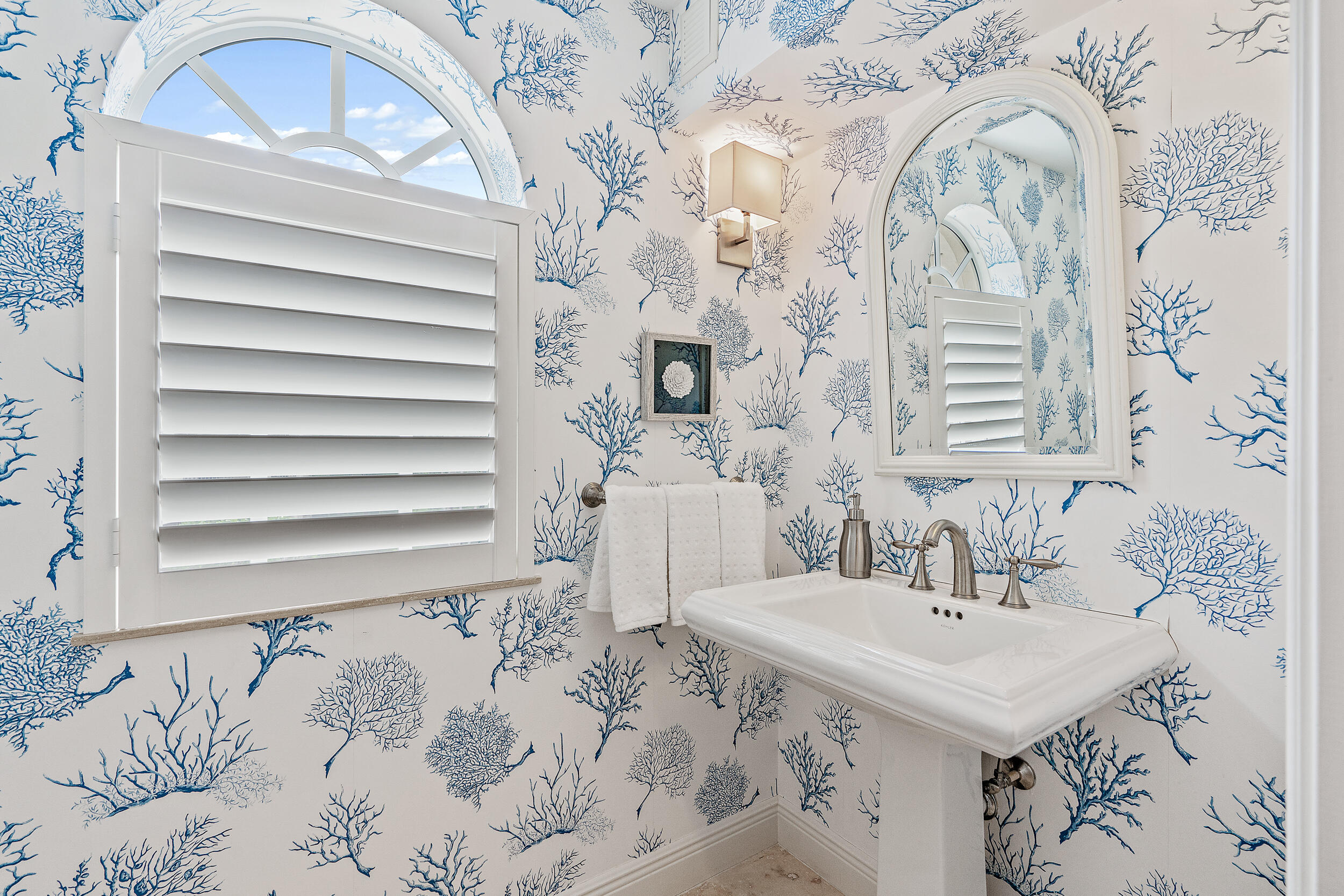 126 Tierra Lane, Unit 4 Jupiter, FL 33477 - Photo 32 of 45 a bathroom with a sink and a mirror