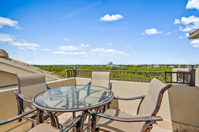 a terrace of a house with outdoor seating