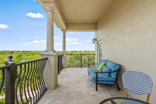 a balcony with furniture and city view