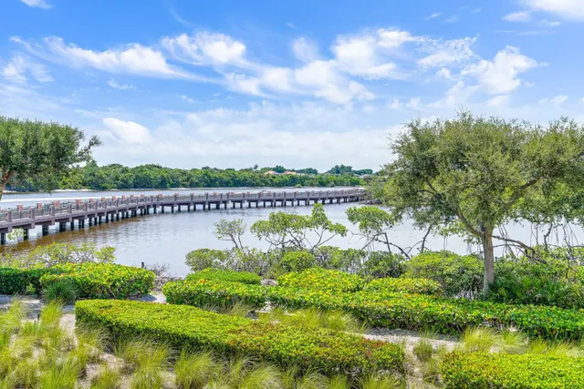 an aerial view of residential house with outdoor space and lake view
