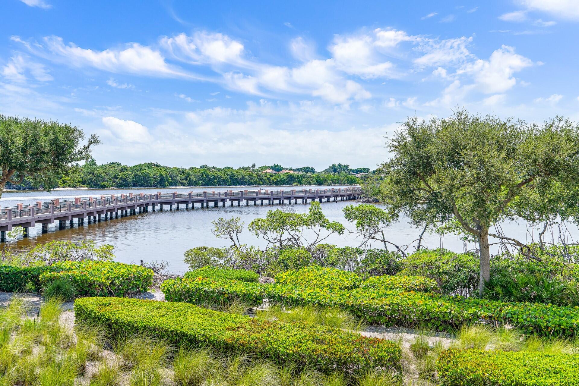 126 Tierra Lane, Unit 4 Jupiter, FL 33477 - Photo 40 of 45 a view of a lake with a big yard