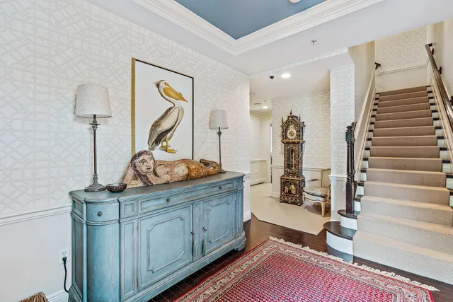 a view of a hallway with paintings on the wall