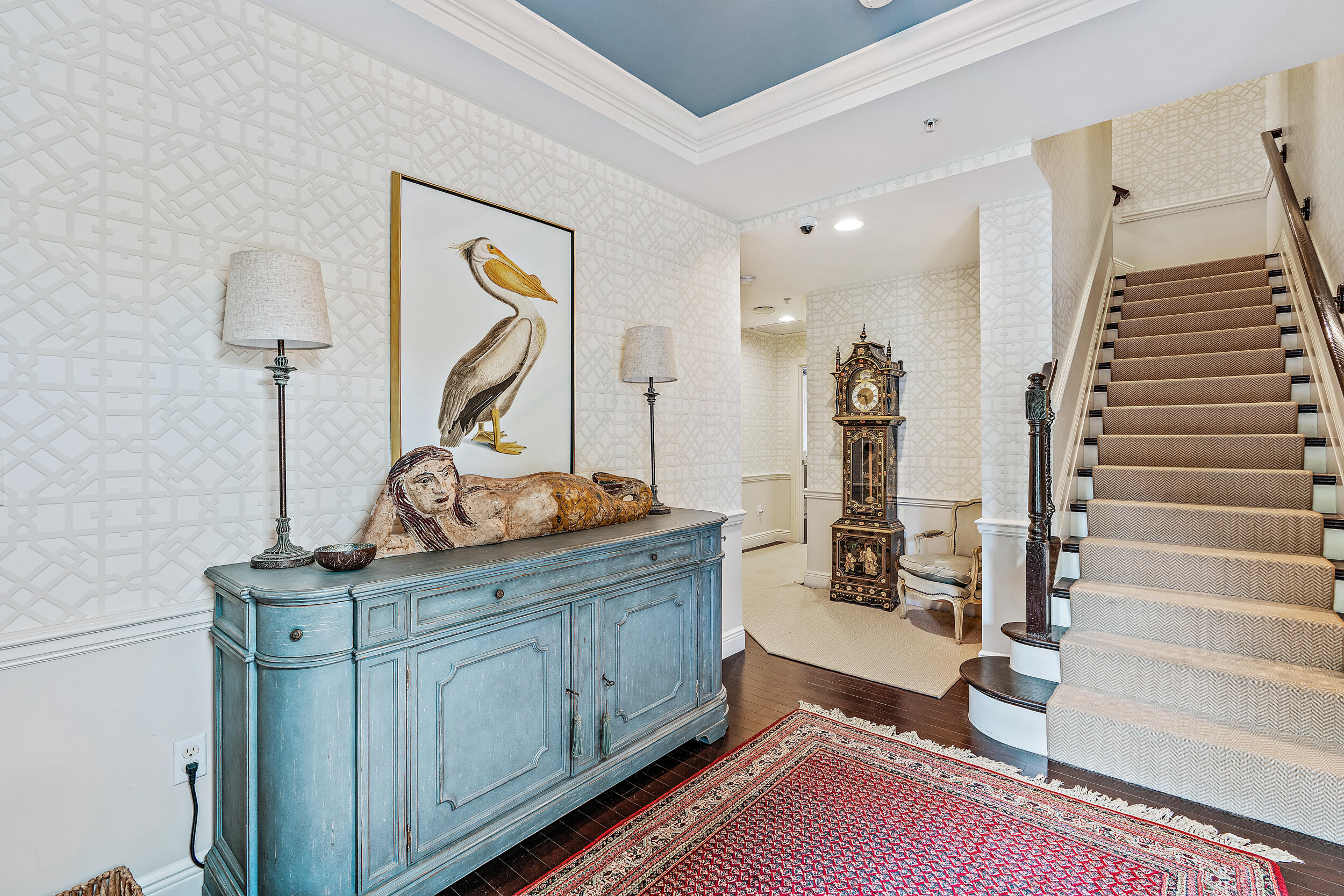 126 Tierra Lane, Unit 4 Jupiter, FL 33477 - Photo 5 of 45 a view of a hallway with paintings on the wall