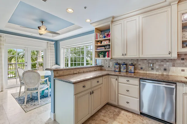 a kitchen that has a sink and a stove in it