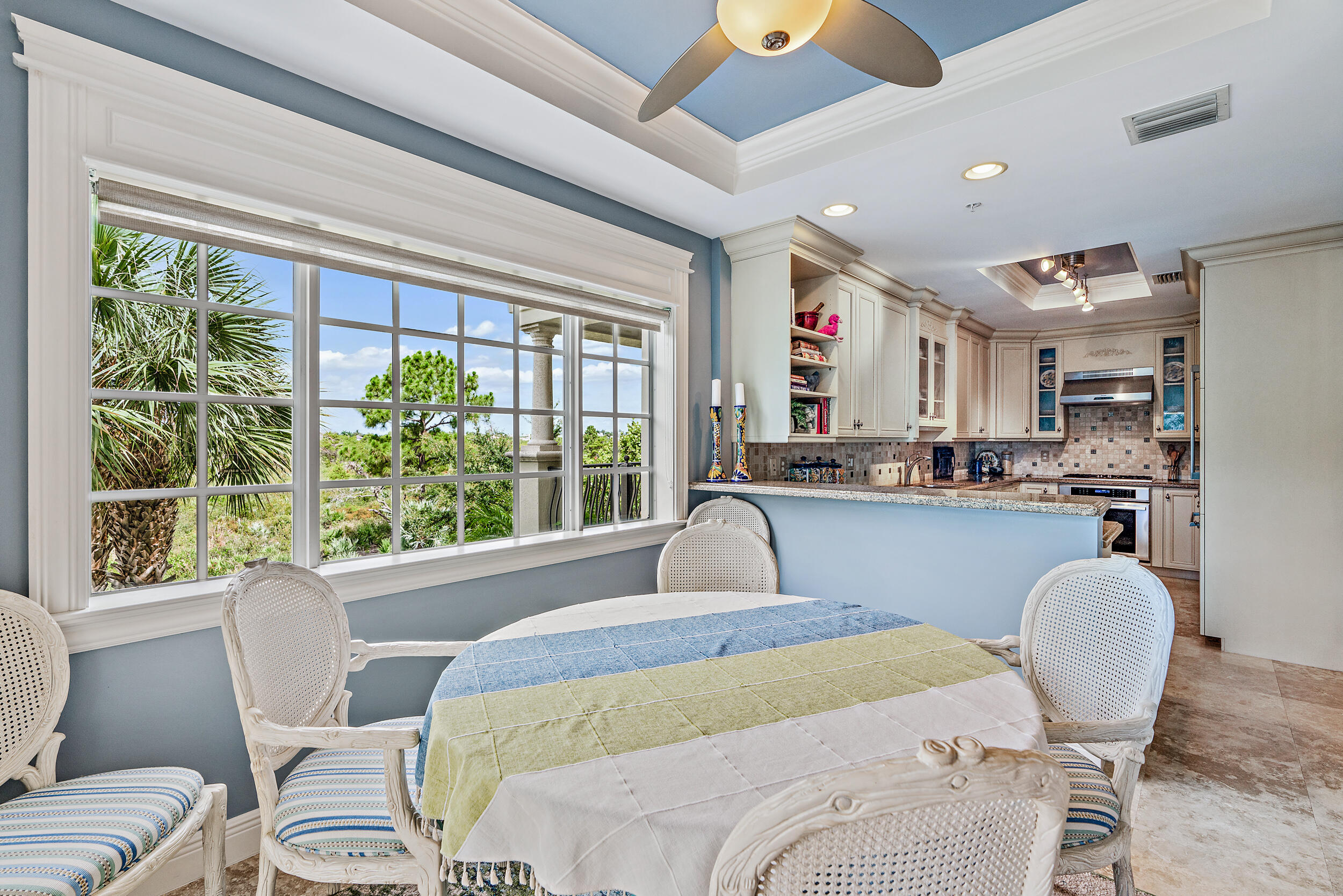 126 Tierra Lane, Unit 4 Jupiter, FL 33477 - Photo 10 of 45 a bedroom with furniture and a large window